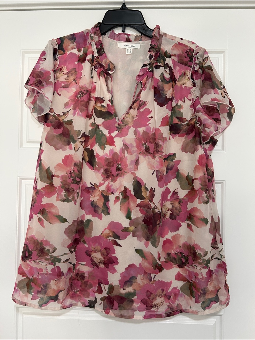 Floral Ruffle V-Neck Blouse in Shades of Pink and Lavender on a Cream Base.